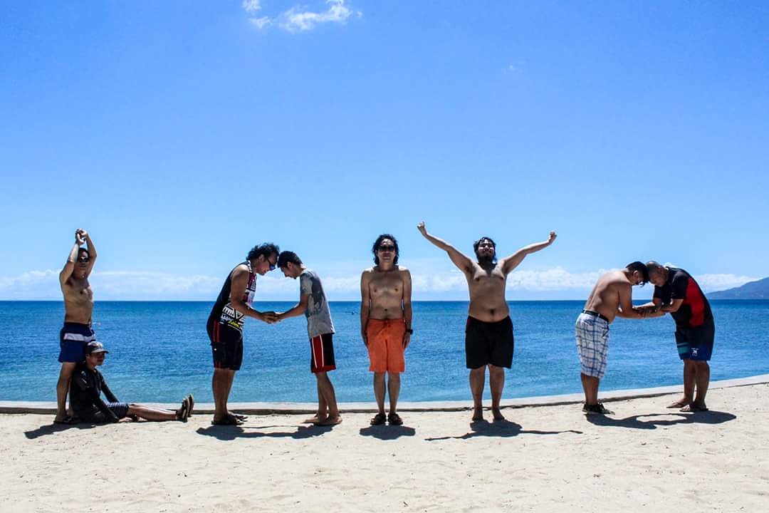 Me with fellow male blogger friends doing a tableau by the beach