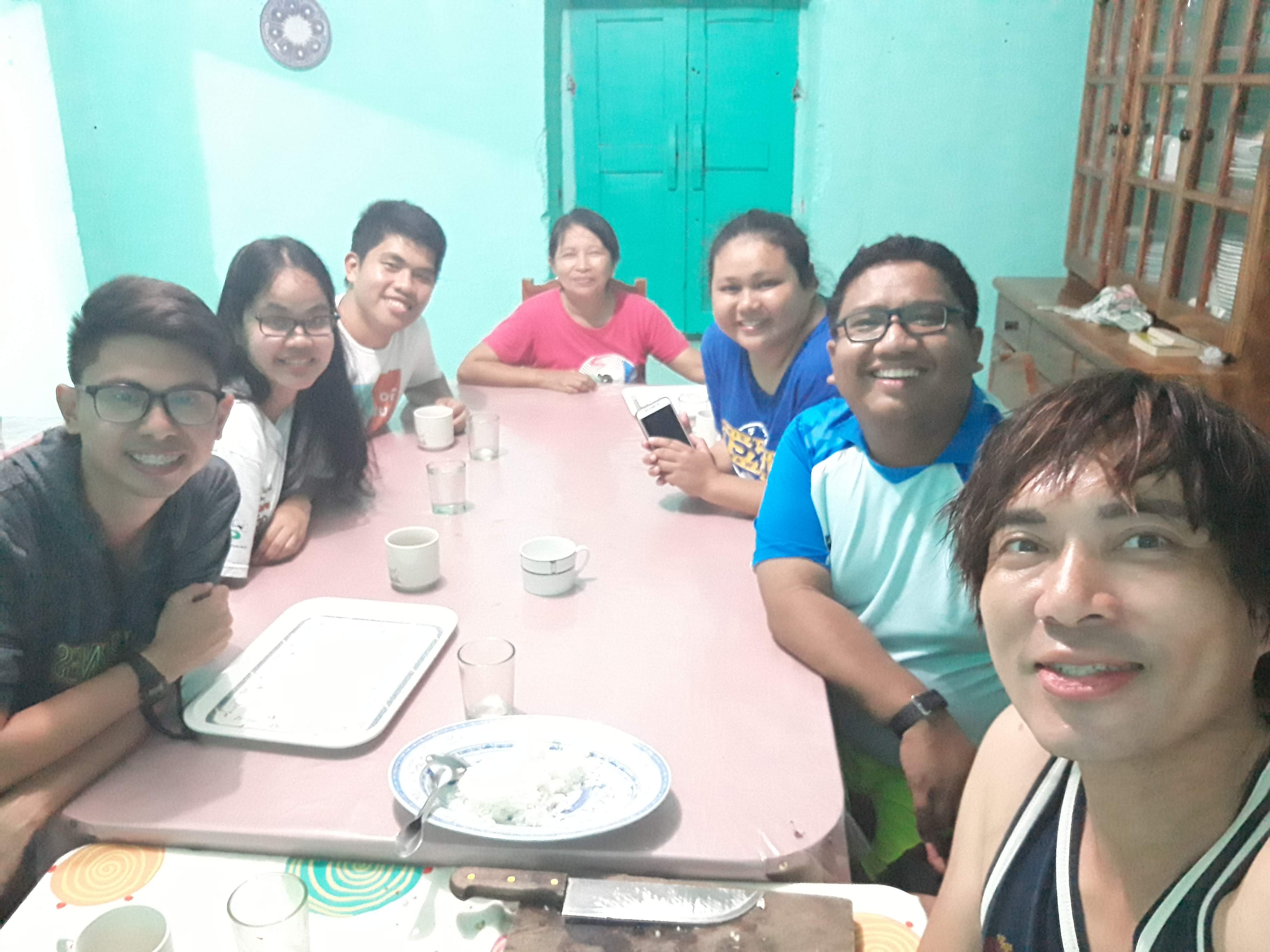 Photo-op with Tita Neyala and fellow backpackers at the dining area of Neyala's Homestay in Sabtang, Batanes