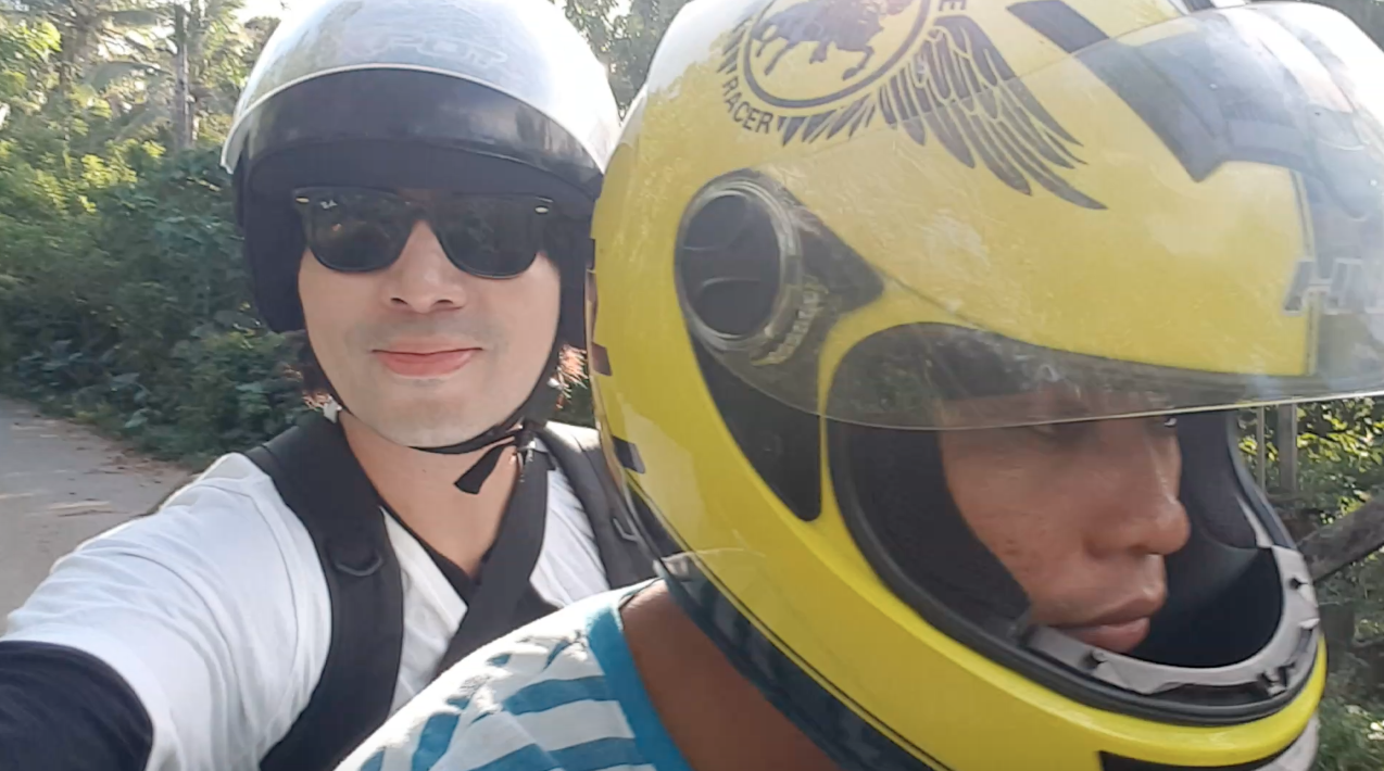Me on a bike with tour guide John during one of the side trips arranged by Arkipelago Divers